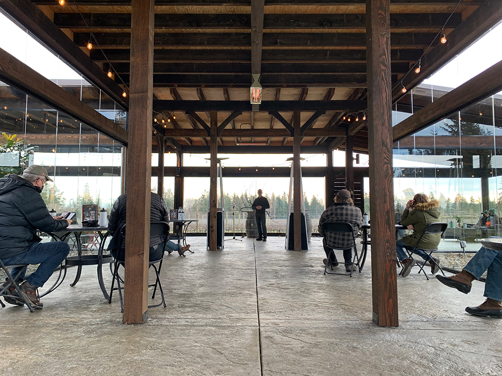 image of Layne Craig giving lecture in the outdoor terrace.